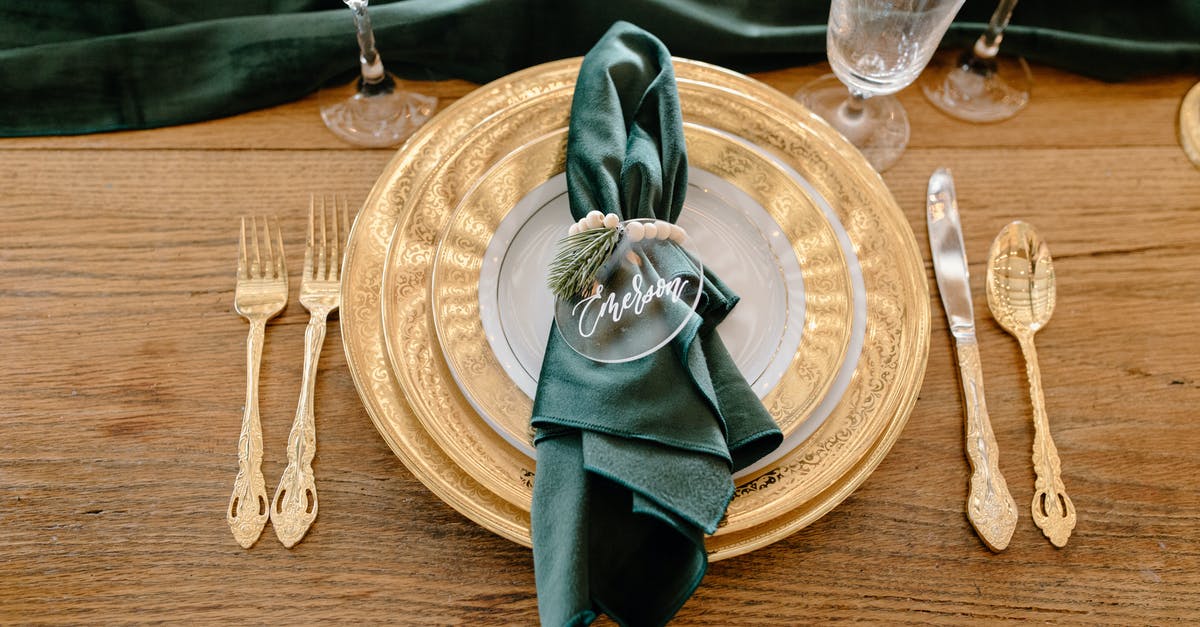 How is Smough's name pronounced? - Table setting with elegant tableware and personalized napkin ring