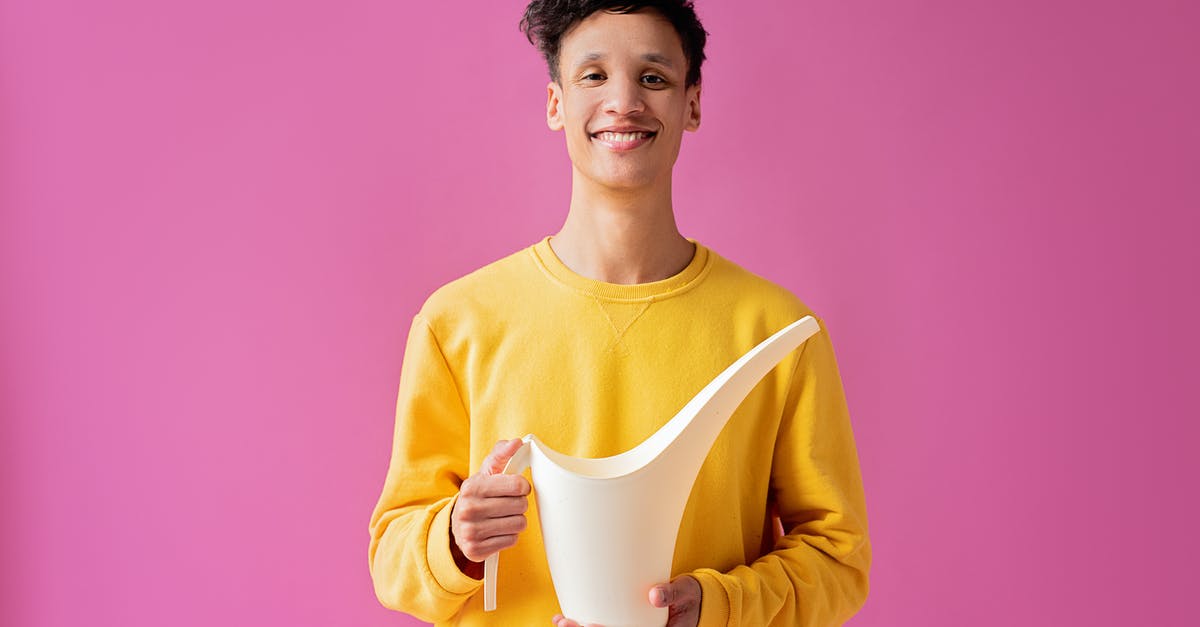 How long can we expect an Atari 2600 cartridge to last? - A Handsome Young Man Holding a Long Spout Plastic Watering Can