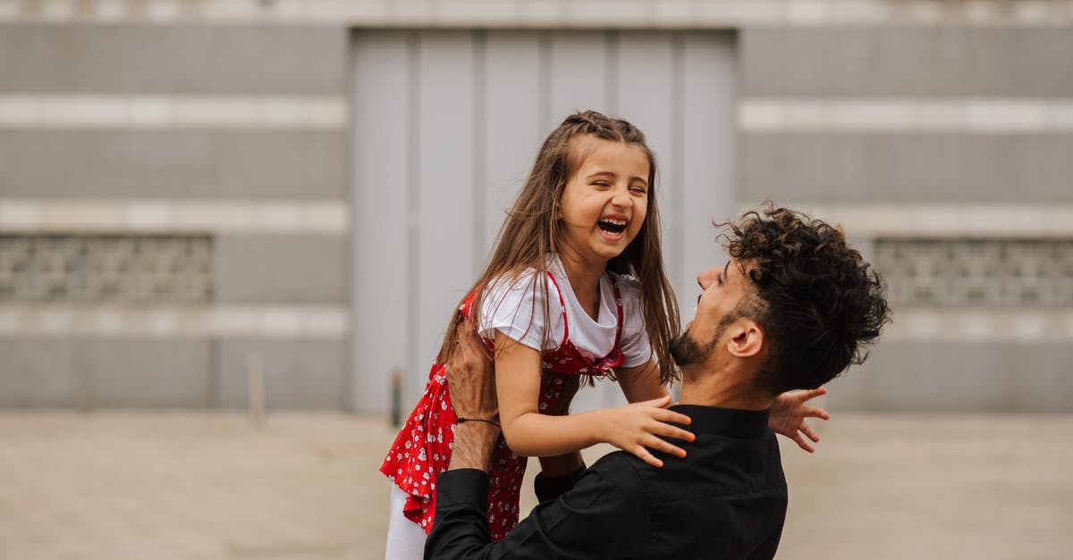 How long is the 60 days of Game Time Cards? - Man carrying smiling little girl in arms and laughing on city street in summer day