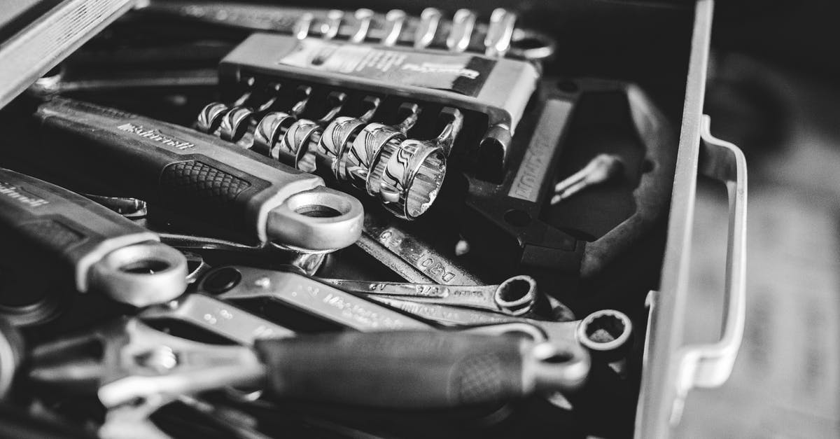 How many different devices has Doom been ported to? - From above black and white cabinet drawer with assorted repair tools in craftsmanship