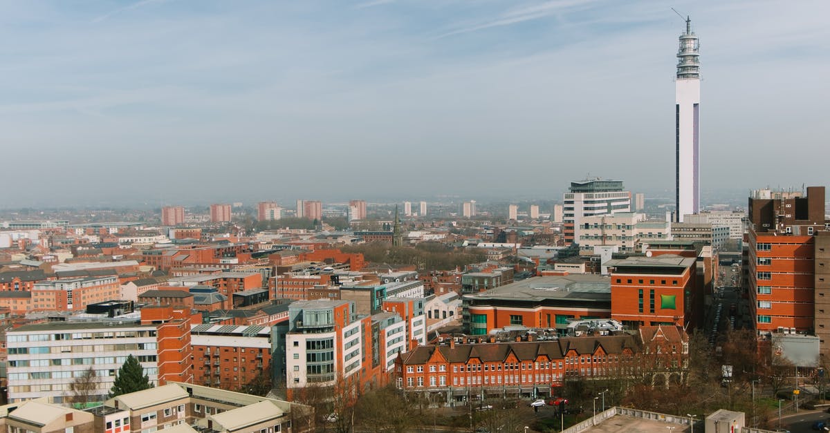 How many entities in an area? - Cityscape with residential buildings and tower