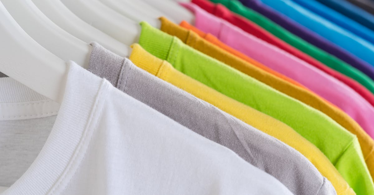 How many free chests can I stack up? - Closeup bright multicolored soft cotton t shirts hanging on rail in well organized wardrobe