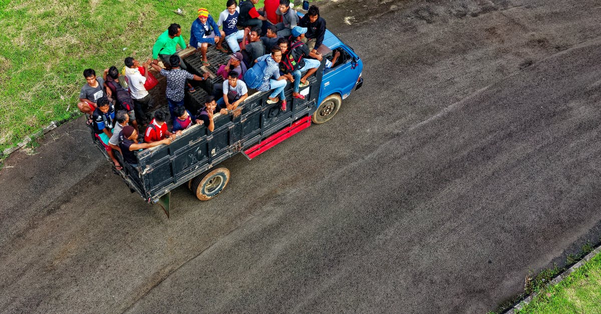 How many original Xbox systems could you system link together? - Aerial Photo of People Riding in Truck