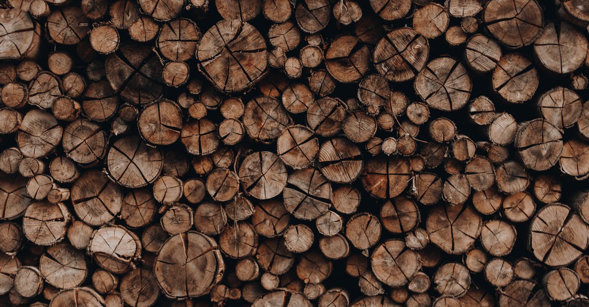 How Many Passengers? - Pile of wooden skids with cracks stacked accurately in rows arranged for cutting