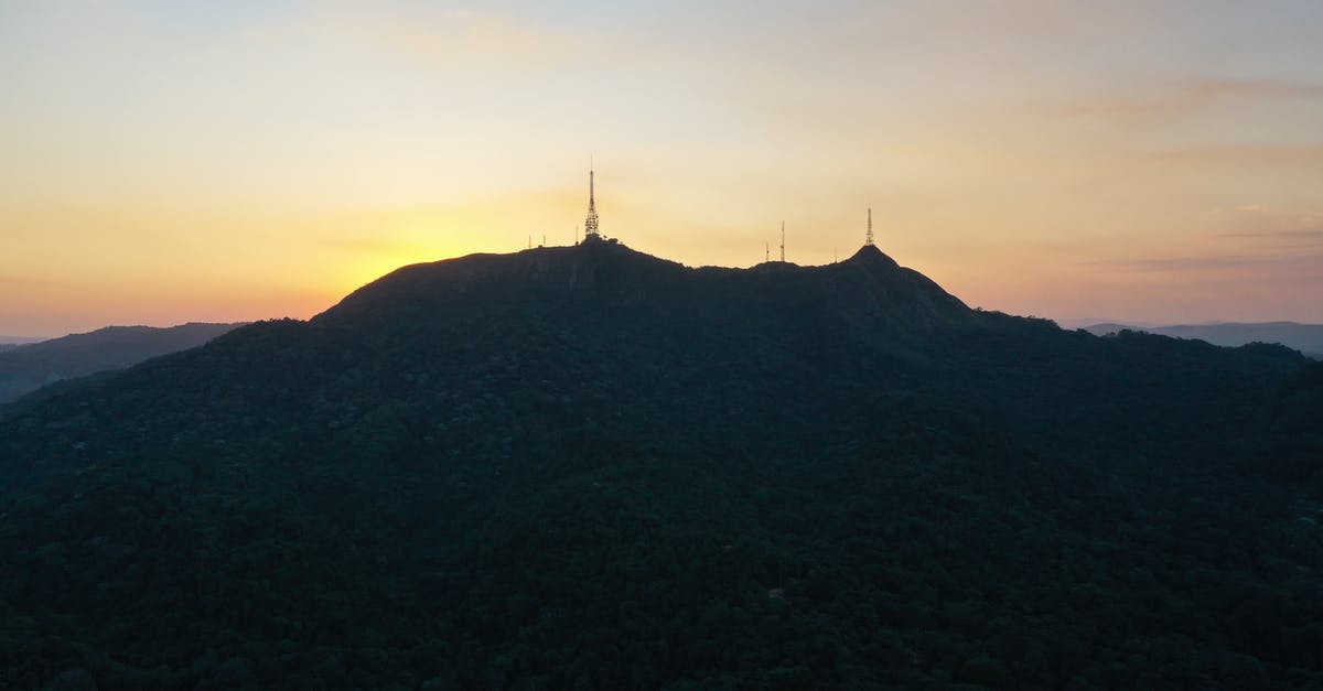 How much do encounter rates vary by location when fishing? - Picturesque scenery of silhouette of Pico do Jaragua mountain with TV towers located in Sao Paulo against sunset sky