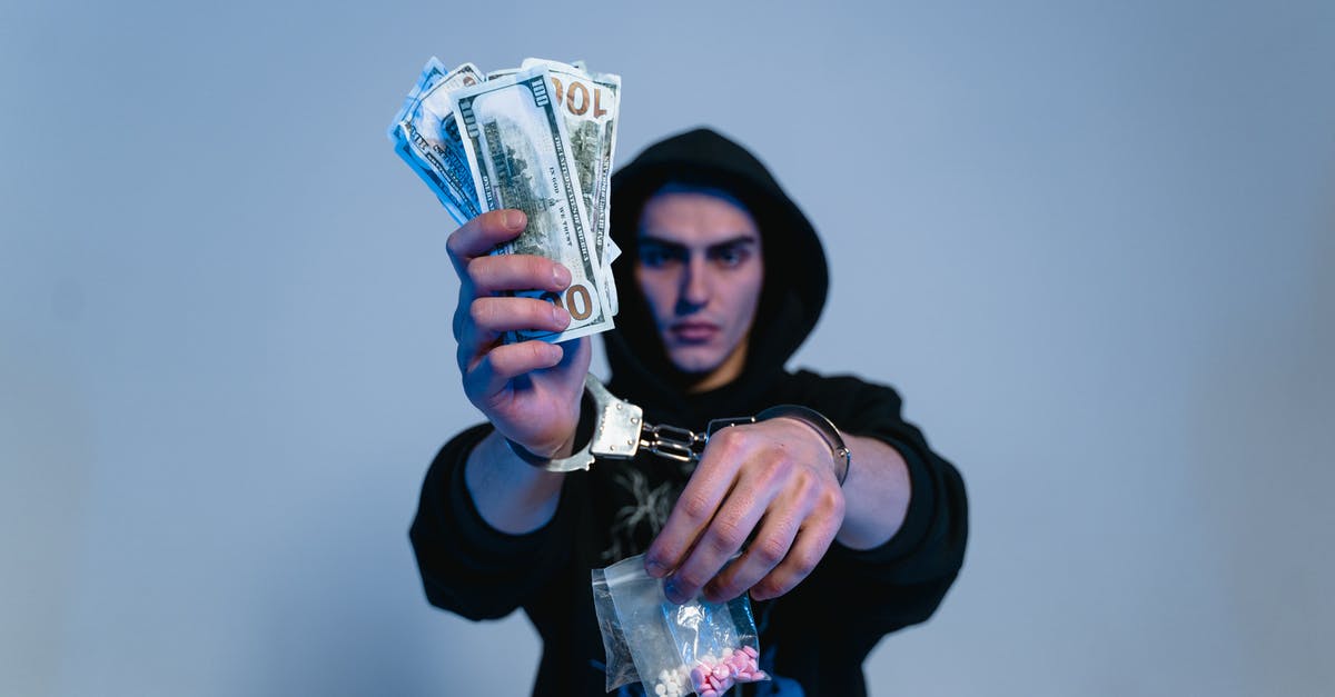 How much money does the radio man require for compensation? - A Man in Black Hoodie Sweater Wearing Handcuffs while Holding Money and Drugs