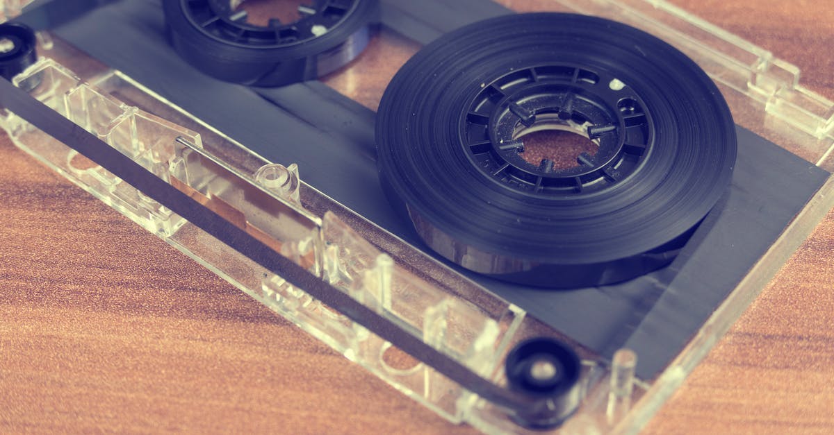 How to backup Minion Rush? - Clear and Black Cassette Tape on Brown Wooden Surface