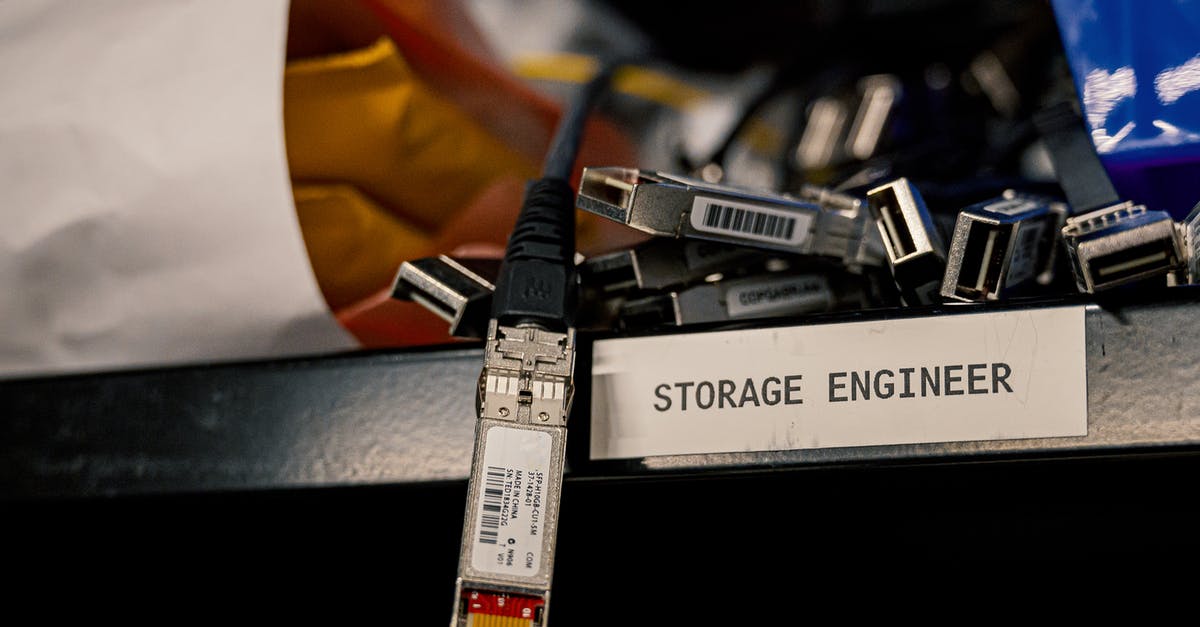 How to connect to European servers? - Low angle of various connectors and USB cables placed on shelf with storage engineer inscription