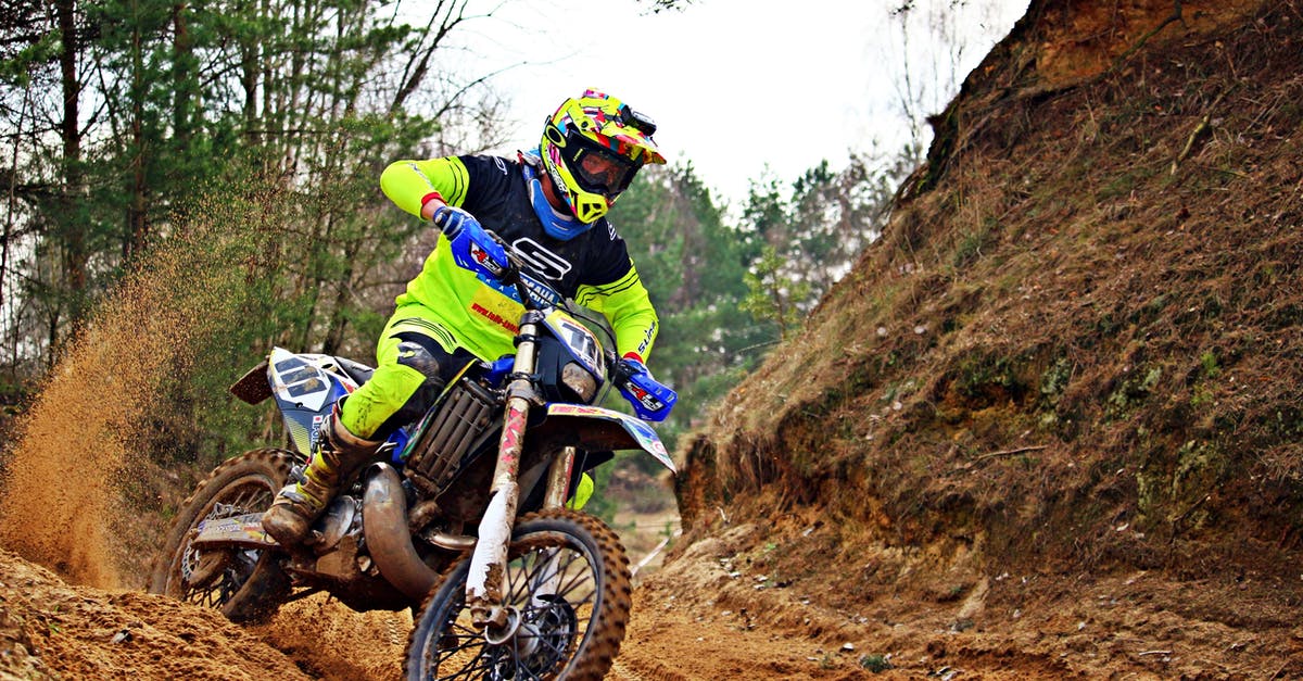 How to cross lava? - Man Riding Blue and White Dirt Bike