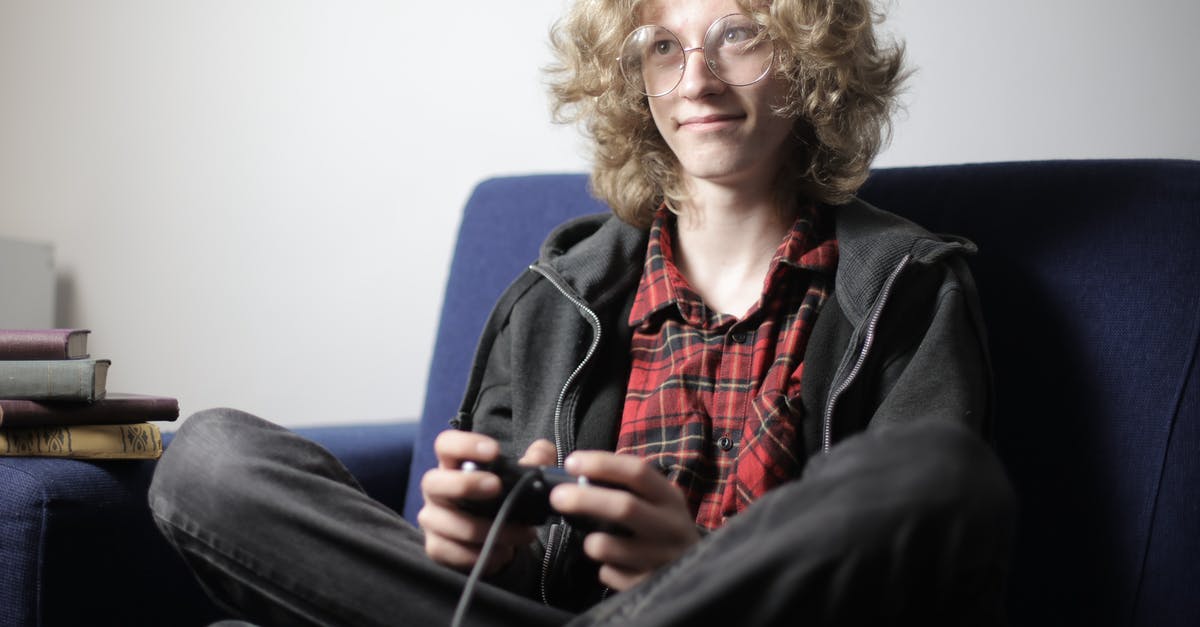 How to deinterlace SNES video for PC play/capture? - Smiling teenager playing video game on sofa