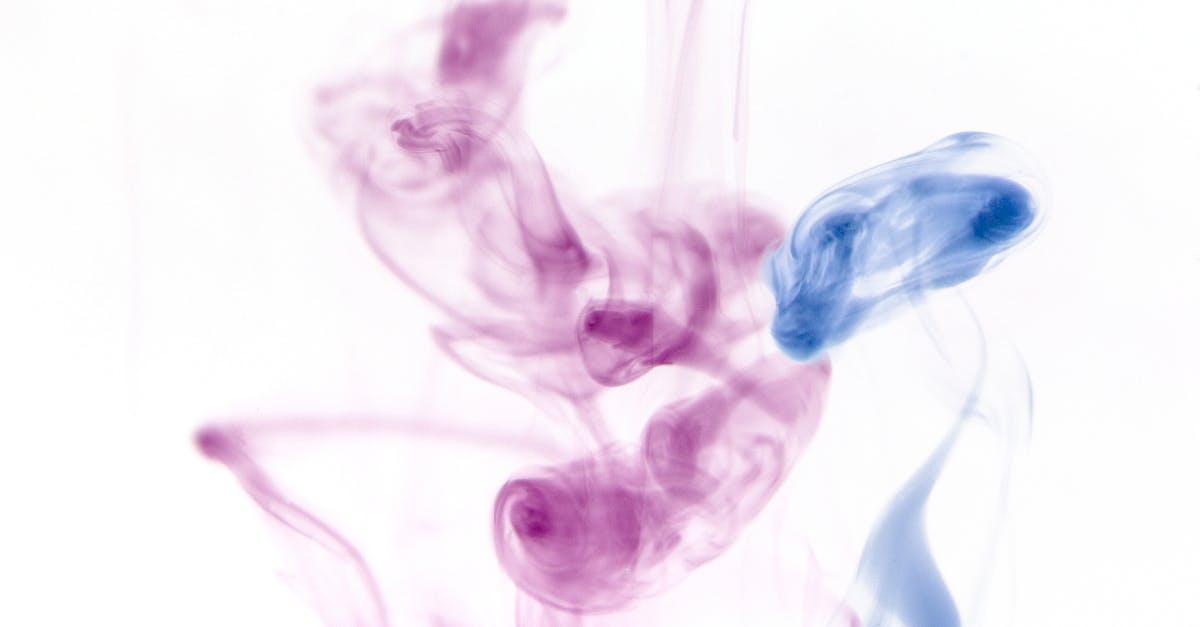 How to delete the effect particle when summoning a mob - Closeup of blue and purple coloured light swirling transparent smoke on white background