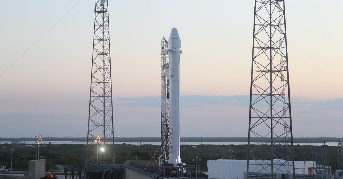 How to design heavy lifter rocket - Space rocket installed on metal construction in spaceport and ready for launching against cloudless sky