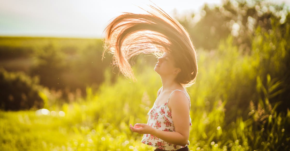 How To Do a Moe-Kill? - Close-Up Shot of a Woman Doing Hair Flip during Sunset