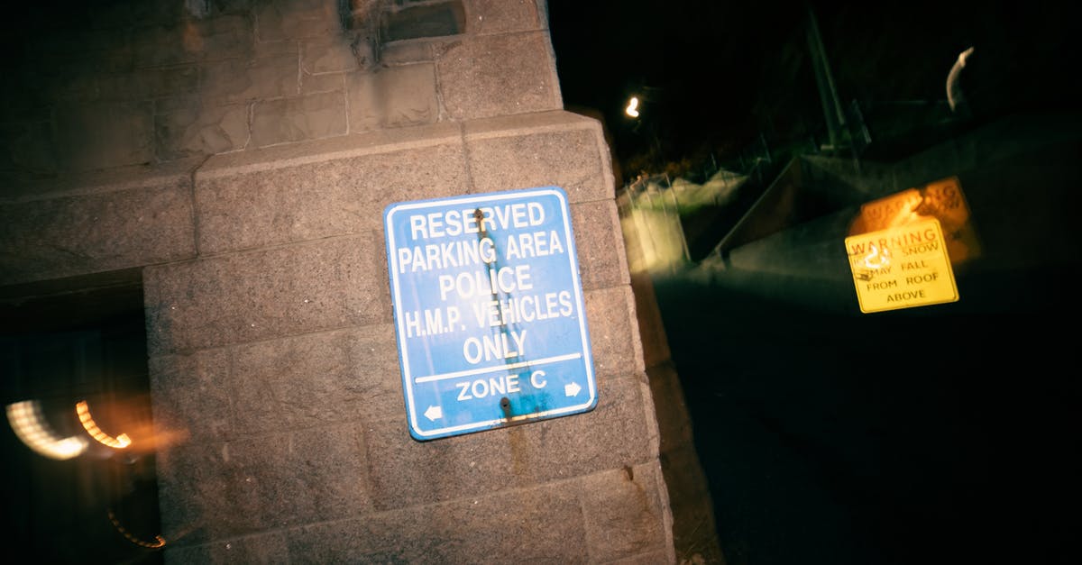 How to find and use Dark Zone keys? - Signboard restricting parking for cars on reserved area for police vehicles at night