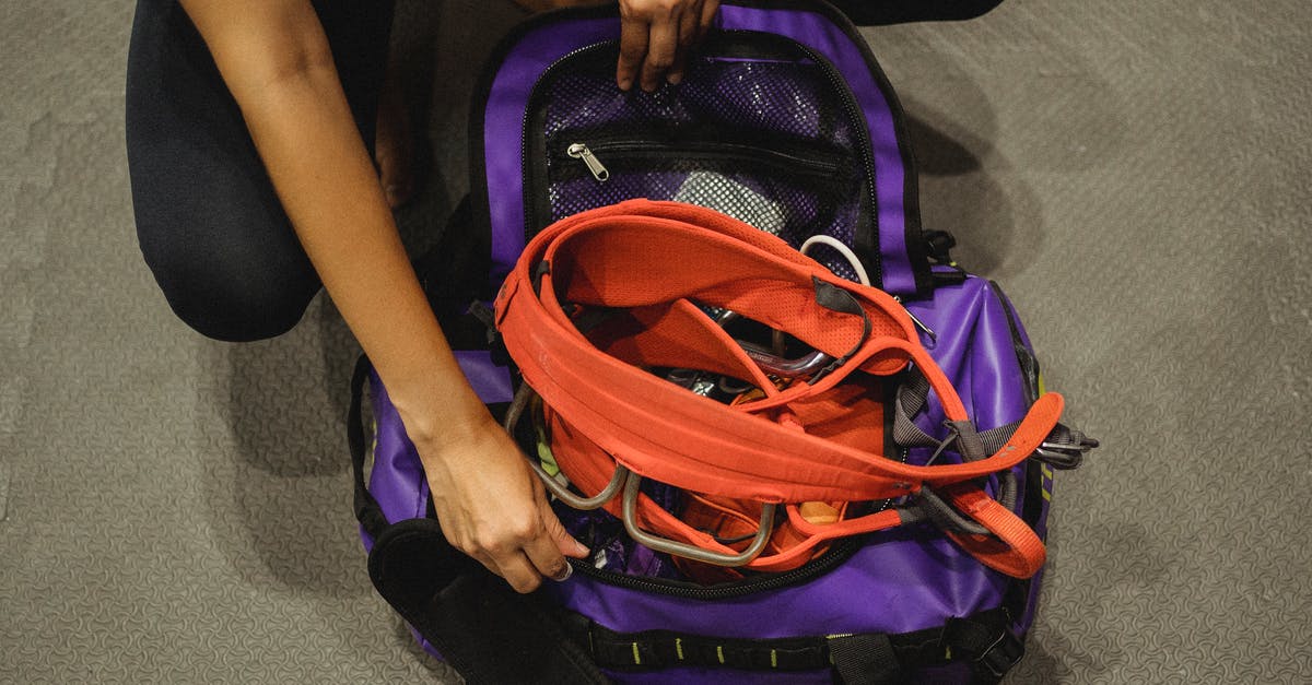 How to get more gigs from fixers? - Crop woman getting safety equipment from violet bag