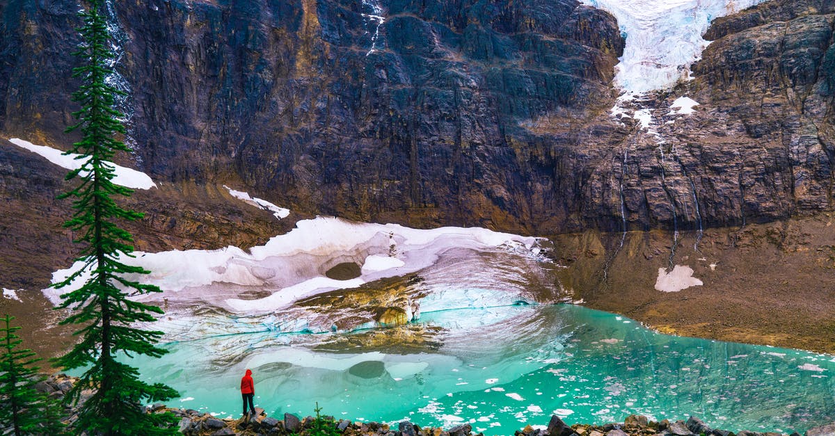 How to get Rock smash in pokemon emerald version - Person in Red Shirt Standing on Rock Near Lake