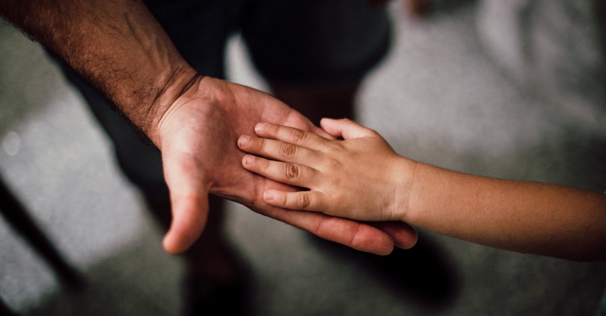 How to manually turn off Rift S Touch controllers when not in use? - Selective Focus Photography of Child's Hand