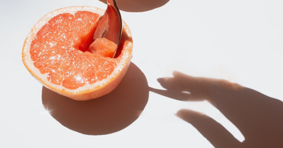 How to produce Ancient Fruits? - Sliced Grapefruit Fruit on White Surface