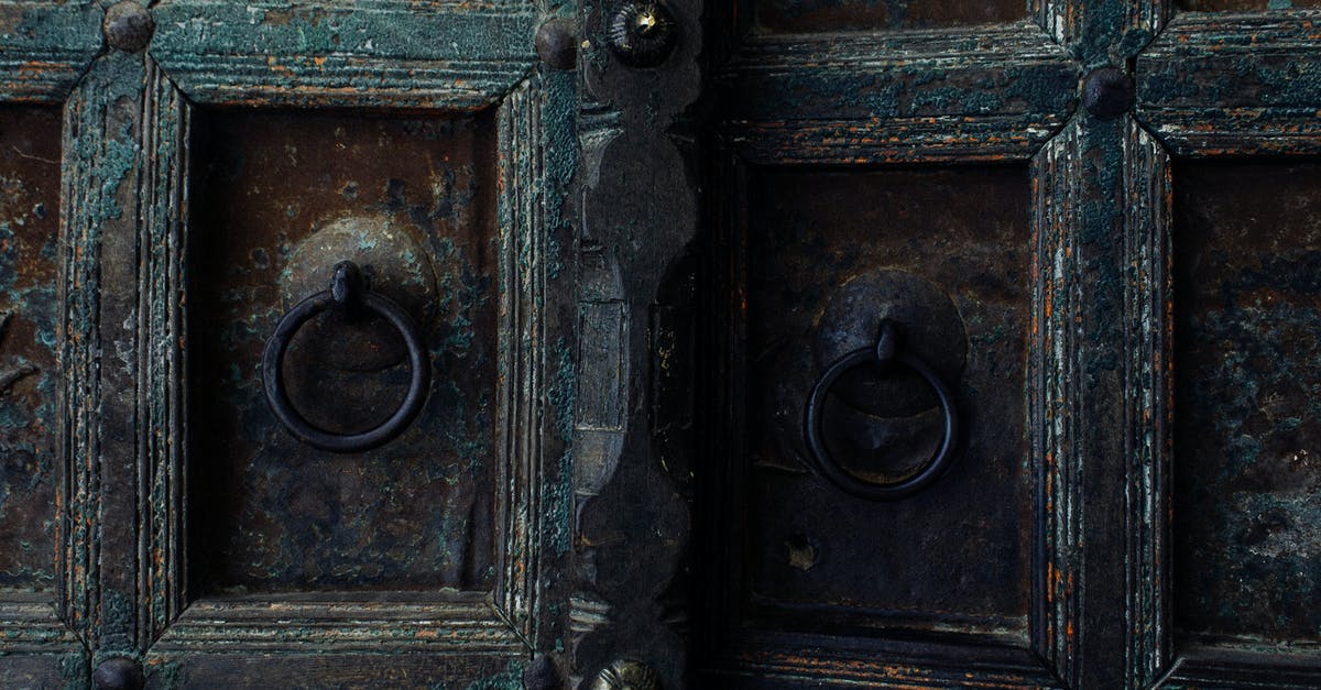 How to pull out Pikachu's D-tilt into jab lock consistently? - Weathered metal gates with metal handles and rusty iron door of aged building