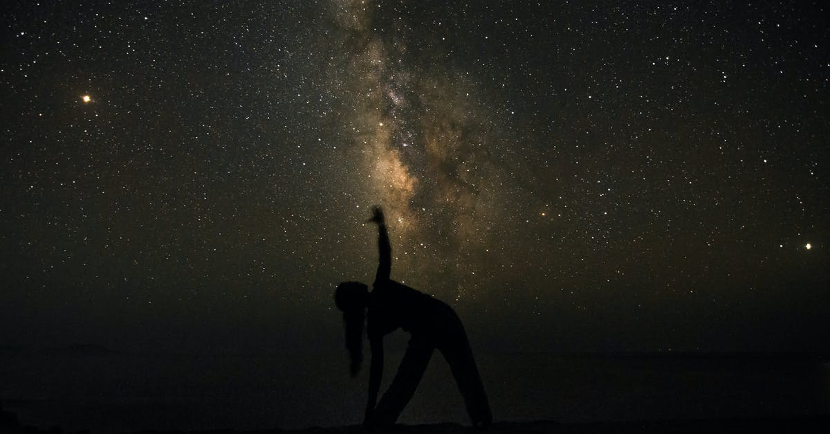 How to reach the planets core in Astroneer? - Silhouette of Man Standing on Beach during Night Time