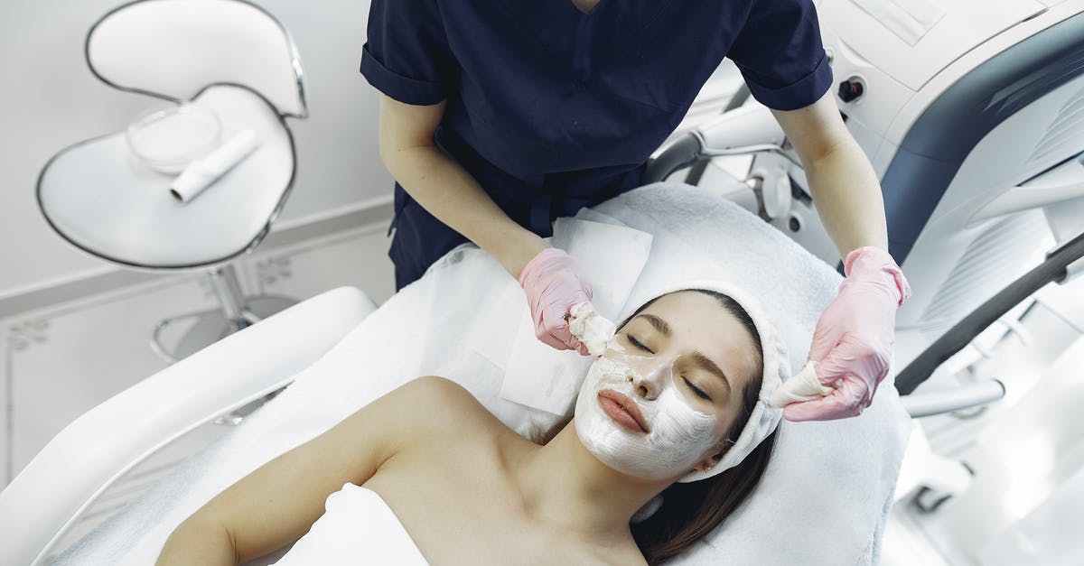 How to remove hacks from my account? [closed] - Crop female cosmetologist removing purifying mask from face of relaxed woman in contemporary clinic