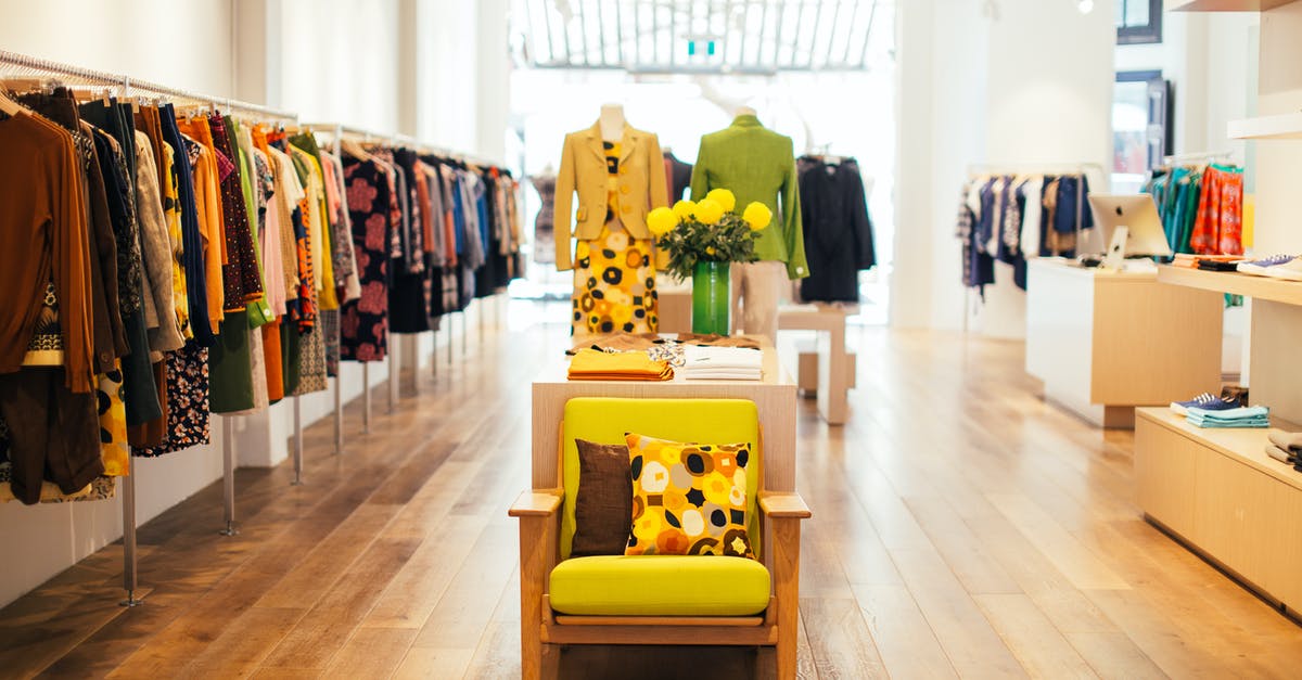 How to select your start kingdom in KoA? - Interior of modern fashion store with stylish colorful clothes handing on rack in daytime