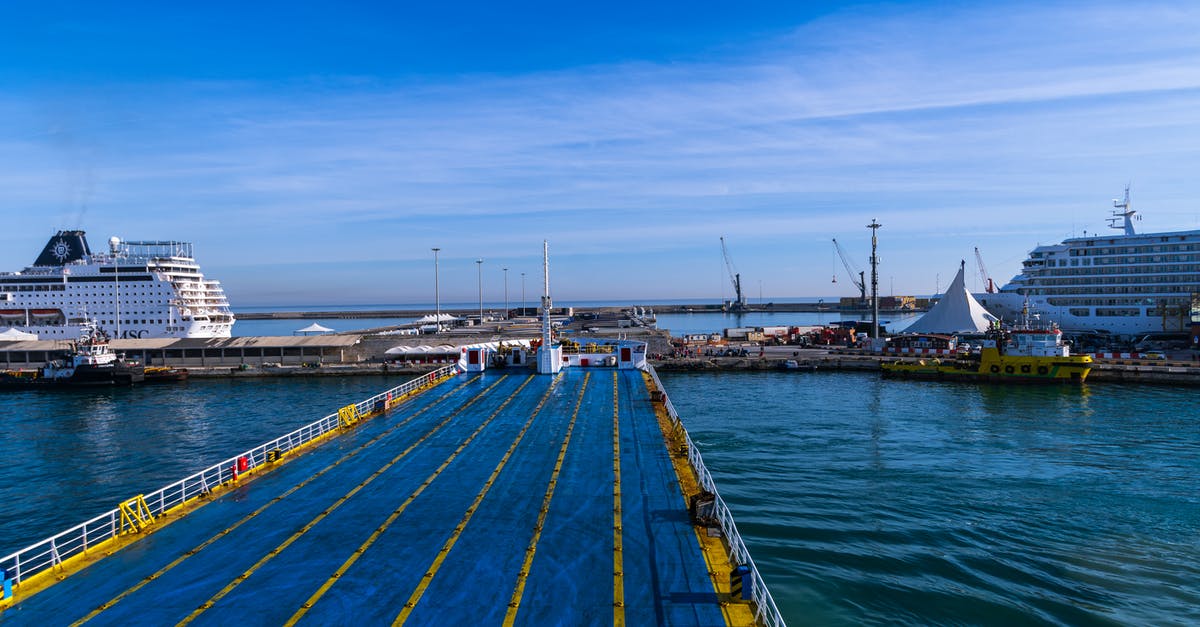 How to tell what ships are pirates? - Brown Wooden Dock on Sea Under Blue Sky