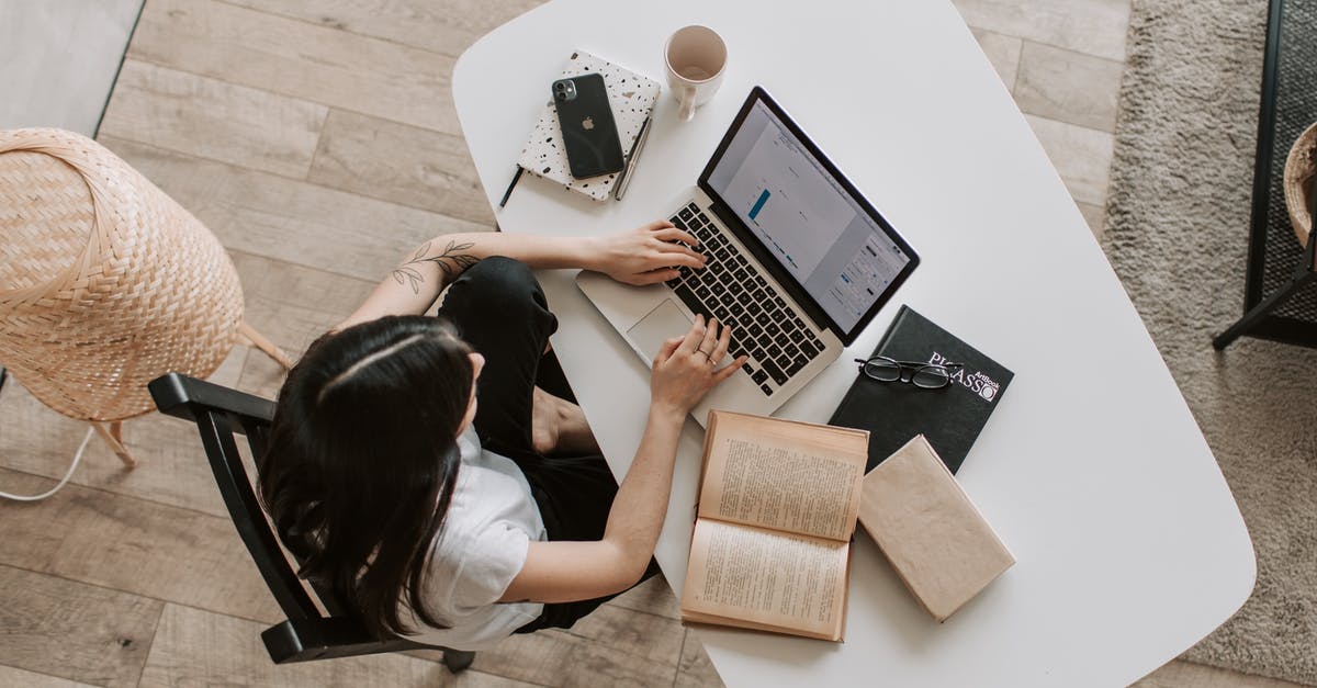 How to use boost when using the keyboard? - Young lady typing on keyboard of laptop in living room