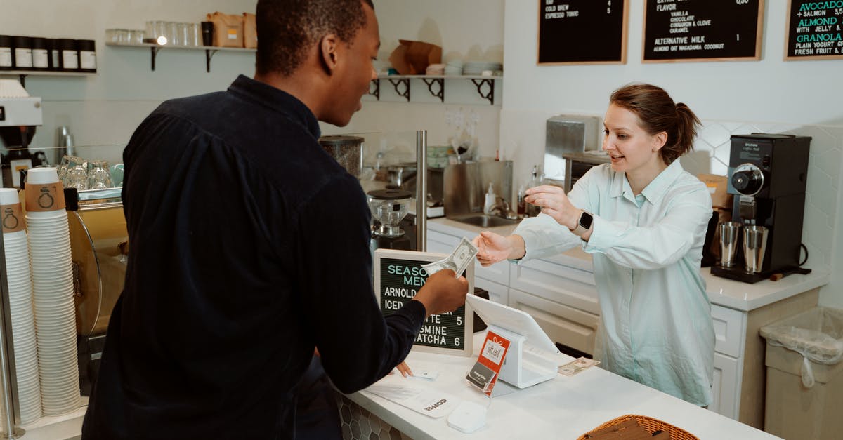 How will I get my money back? - A Woman Receiving Money from the Customer