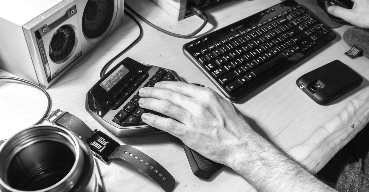 I'm having issues with the Logitech G512 keyboard - Grayscale Photography of Human Left Hand Near Computer Keyboard