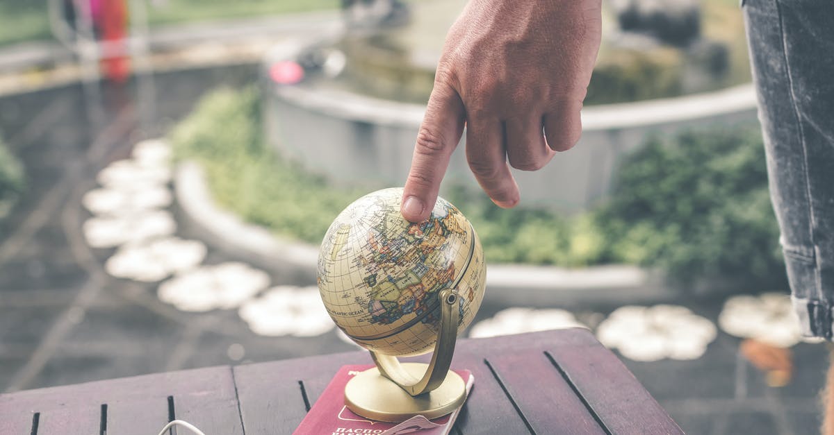 I'm stuck outside the map and I can't get out! - Person Holding Terrestrial Globe Scale Model Taken