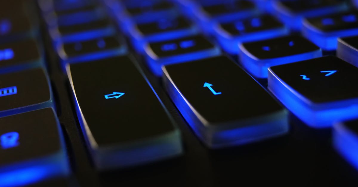 In Mario 64 speedruns, why are the keys necessary? - Closeup Photo of Black and Blue Keyboard