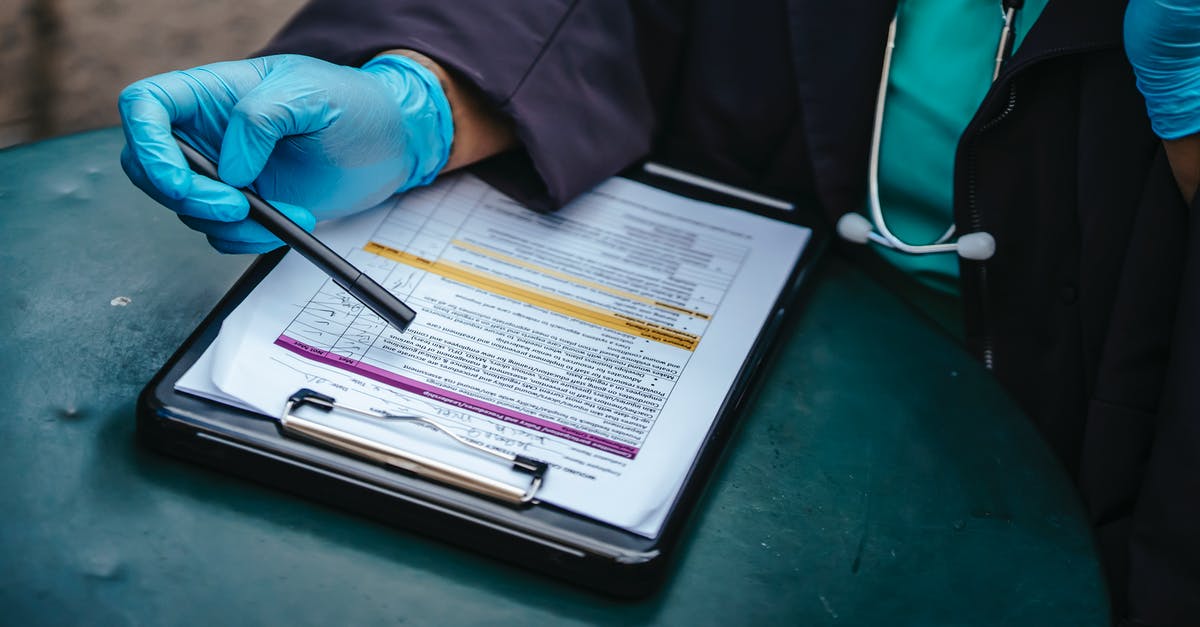 Increase KSP tooltip text size? - From above of crop anonymous plump female doctor in disposable gloves working at table with paper on clipboard