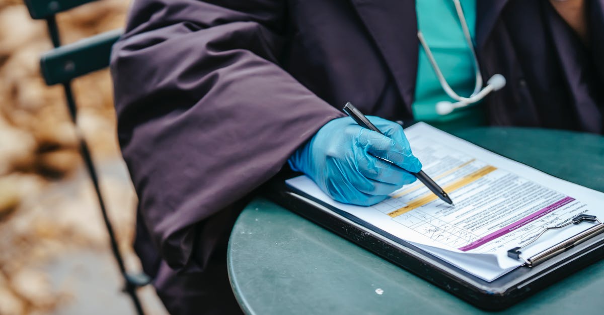 Increase KSP tooltip text size? - Crop anonymous female doctor in uniform with stethoscope pointing with pen at text on paper during work