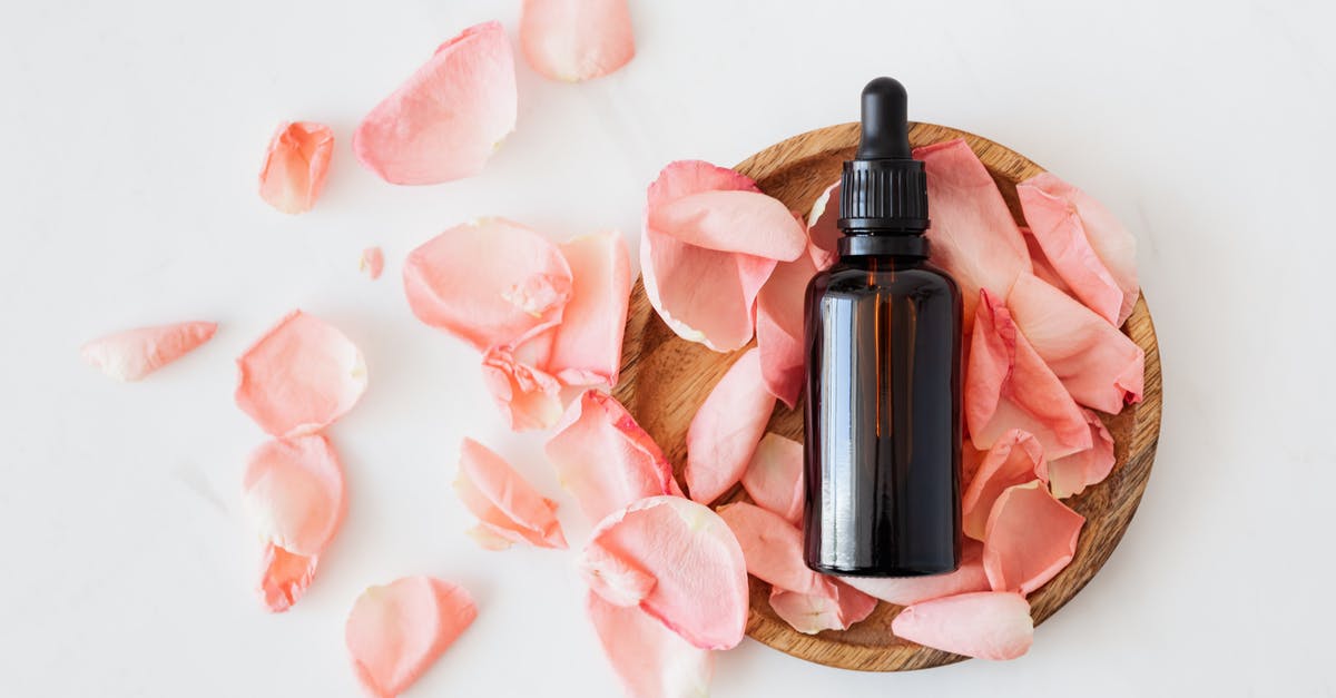 Is it possible to cure gut worms in Rimworld? - Top view of empty brown bottle for skin care product placed on wooden plate with fresh pink rose petals on white background isolated