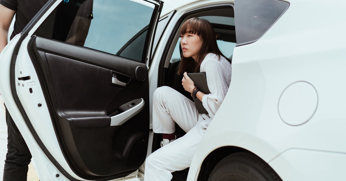 Is it possible to get no-scope kills while using the scope? - Thoughtful unemotional Asian female in stylish white clothes with modern tablet getting off white car