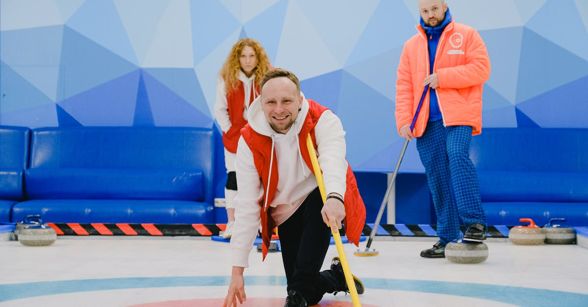 Is it possible to have a strong scout? - Cheerful sportsman playing in curling in ice rink