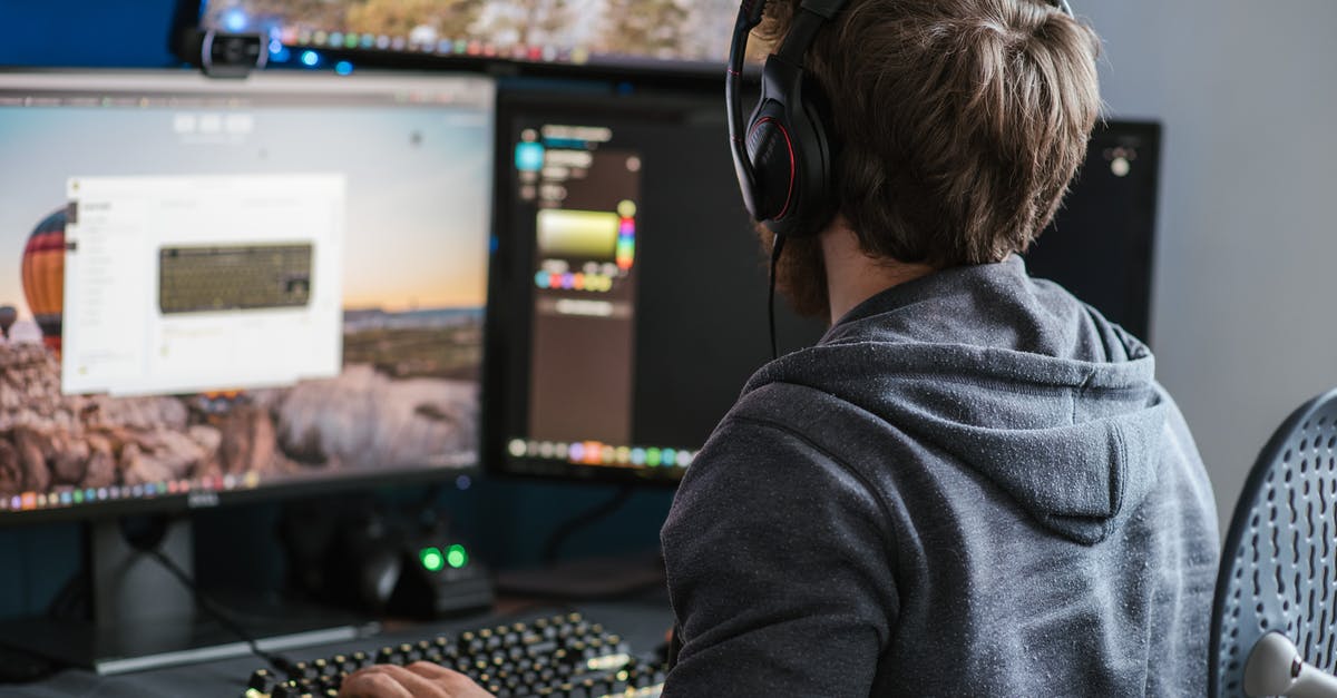 Is it possible to use multiple keyboards? - Unrecognizable man working on computer at home