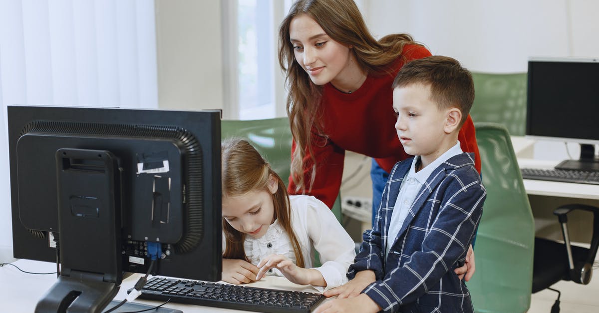 Is it possible to use multiple keyboards? - Teacher with Children Using Computer