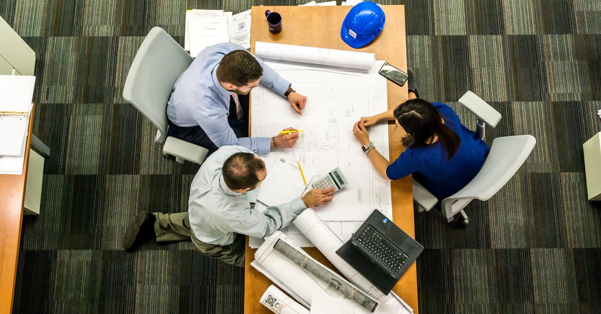 Is it yet possible to blueprint Concrete? - Three People Sitting Beside Table