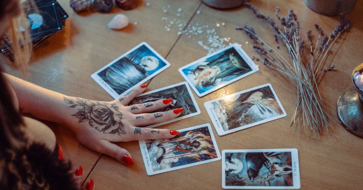 Is Luck dependent on the Fortune Teller? - Assorted Tarot Cards On Table