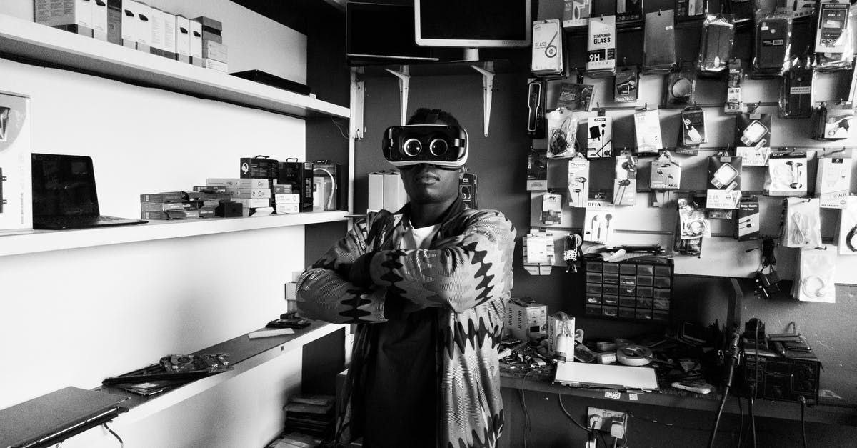 Is Minecraft VR cross play with other platforms? - Black man in VR goggles in electronics store