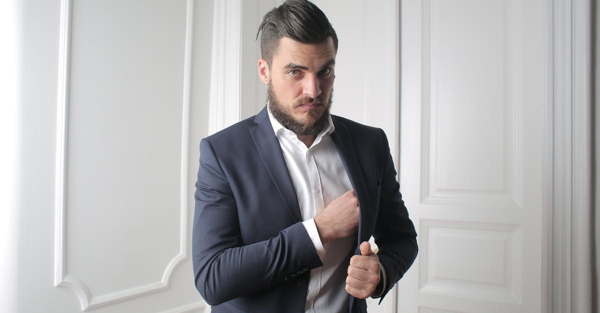 Is my job successful if I die after the objectives are complete? - Man in Blue Suit Standing Beside White Wooden Wall Is my job successful if I die after the objectives are complete? - Man in Blue Suit Standing Beside White Wooden Wall