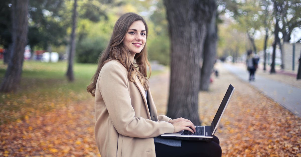 Is possible to use manual refuel in Kerbal Space Program? - Joyful confident woman using netbook in park