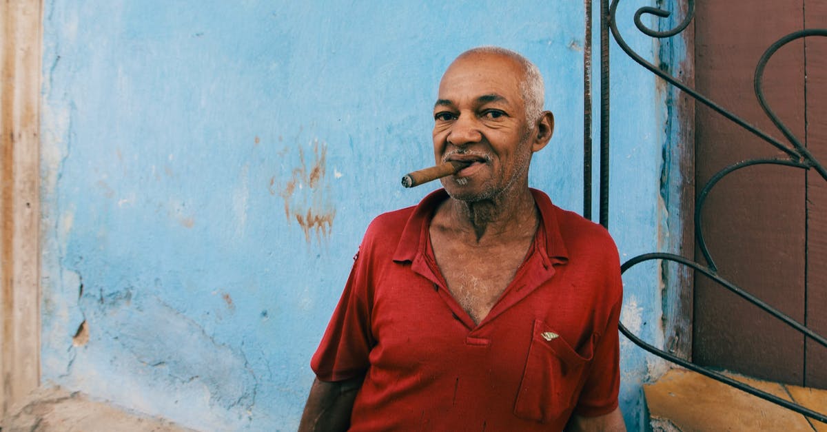 Is smoking battleships worthless? - Man in Red Polo Shirt Smoking Cigarette