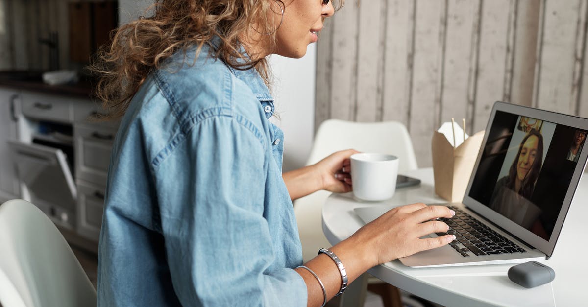 Is there a command to display my coordinates in chat? - Woman in Blue Denim Jacket Using Macbook Pro