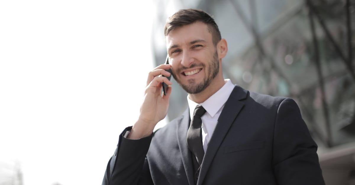 Is there a connection between The Master and MODUS? - Man in Black Suit Jacket Holding Smartphone