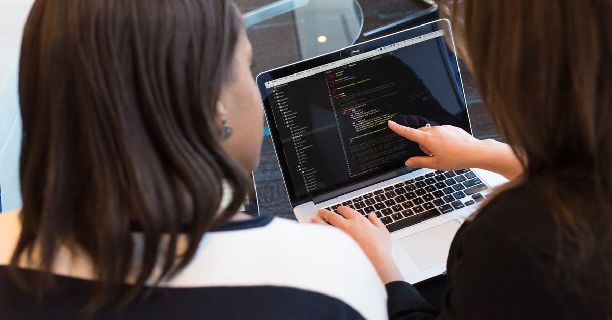 Is there a file limit? - Two Women Looking at the Code at Laptop