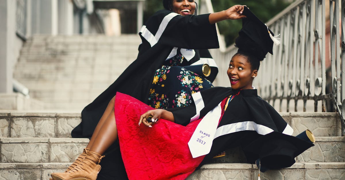 Is there a length cap? - Shallow Focus Photography of Two Women in Academic Dress on Flight of Stairs