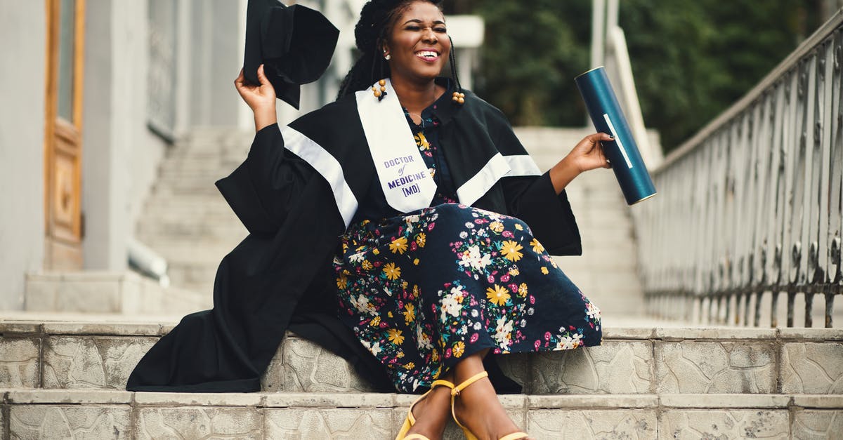 Is there a length cap? - Photo of Woman Wearing Academic Dress and Floral Dress Sitting on Stairway